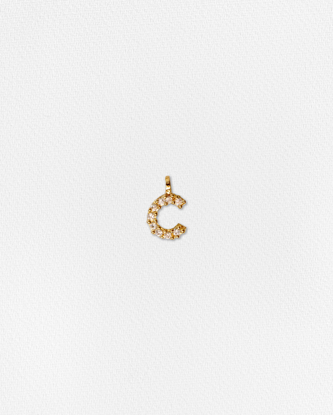 Charm inicial con zirconias