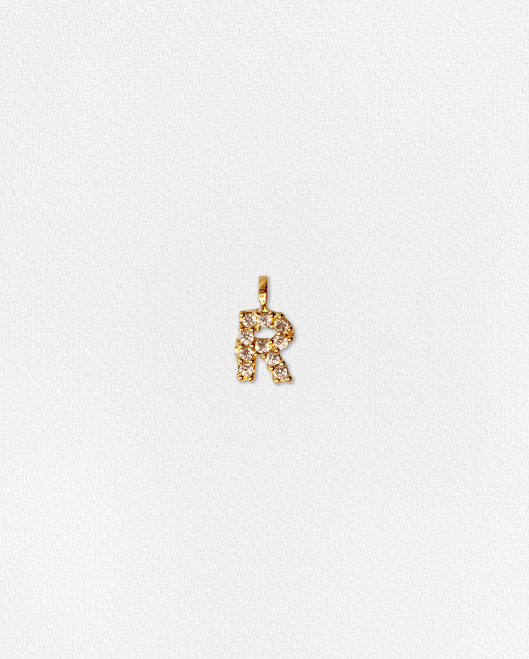 Charm inicial con zirconias